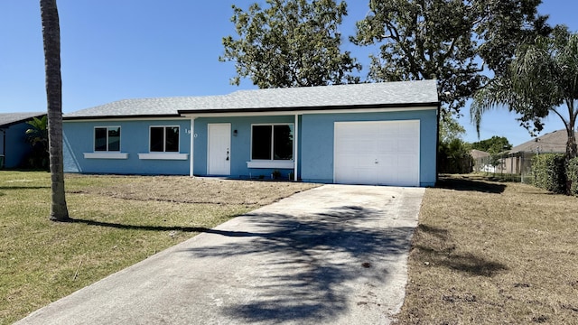 single story home with a front yard, driveway, an attached garage, and stucco siding