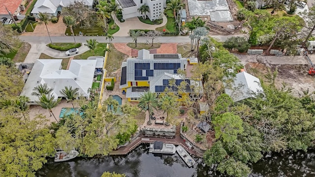 birds eye view of property with a residential view and a water view