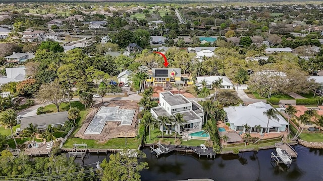 bird's eye view with a residential view and a water view