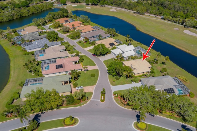 bird's eye view featuring a residential view and a water view