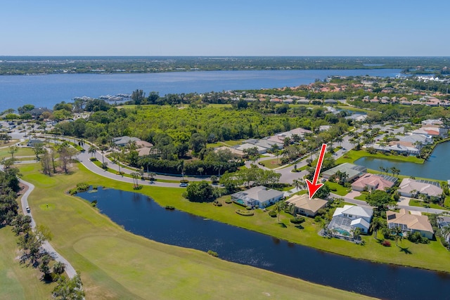 bird's eye view featuring a residential view and a water view