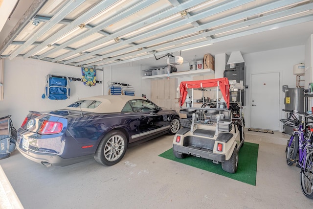 garage with a garage door opener and water heater