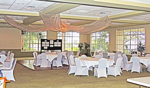 dining space with ornamental molding