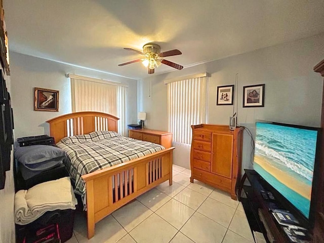 bedroom featuring light tile patterned floors and a ceiling fan