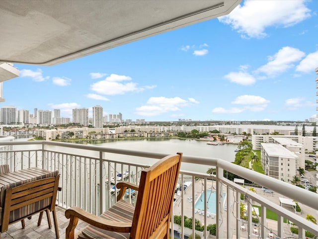 balcony featuring a water view and a view of city