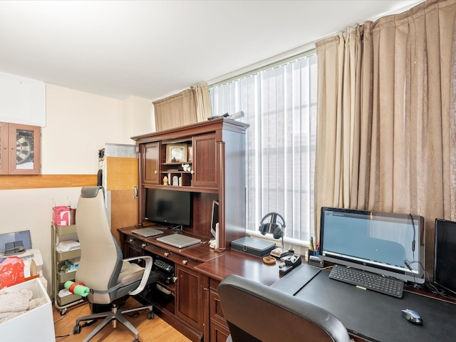 home office featuring light wood-style flooring