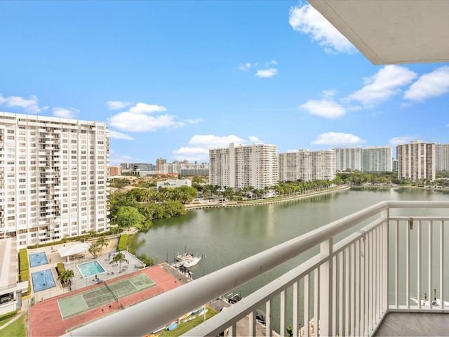 balcony with a water view and a city view