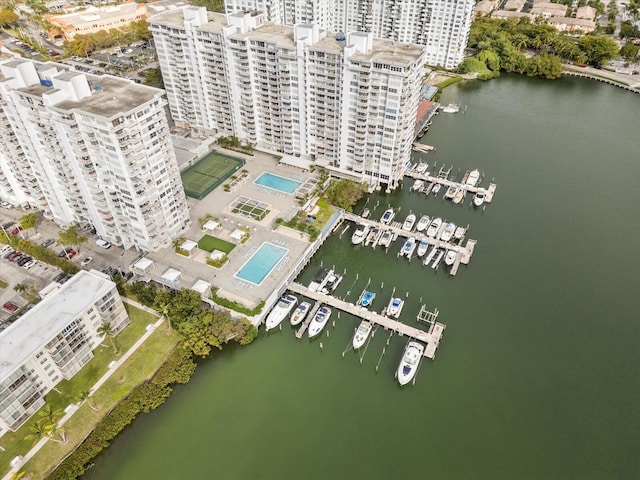 drone / aerial view featuring a water view and a city view