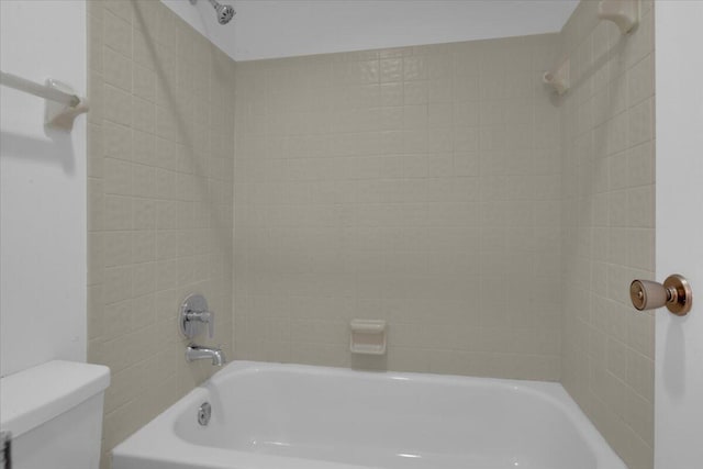 full bathroom featuring shower / tub combination and toilet