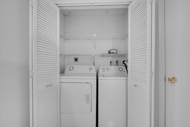 washroom with laundry area and separate washer and dryer