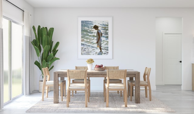 dining space featuring light wood-style floors