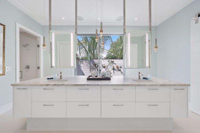 full bathroom with a shower, a sink, baseboards, and double vanity