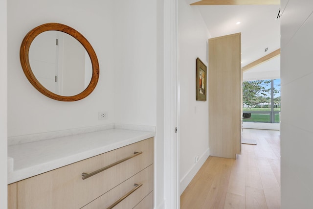 corridor featuring light wood-style flooring