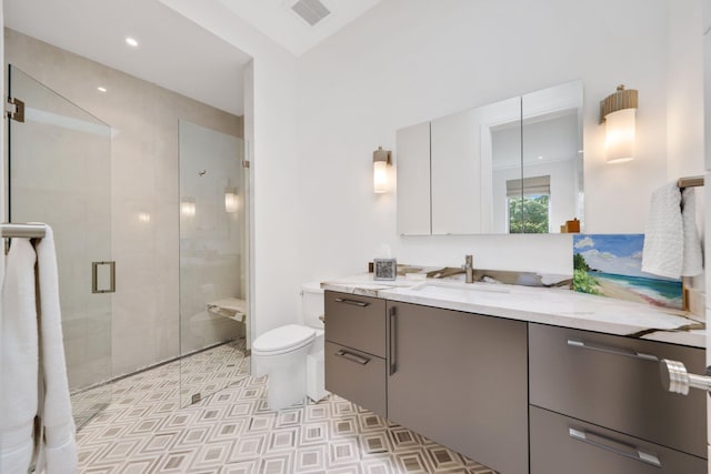 bathroom featuring a stall shower, visible vents, toilet, vanity, and recessed lighting