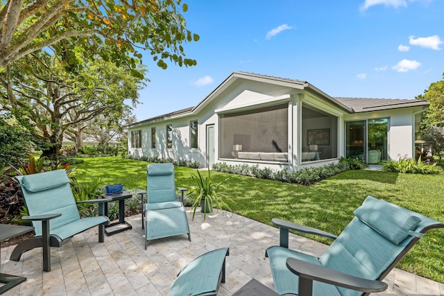 view of patio / terrace with a sunroom