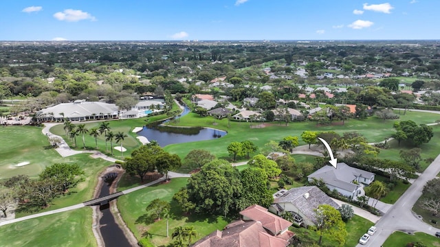 aerial view with a residential view, a water view, and golf course view