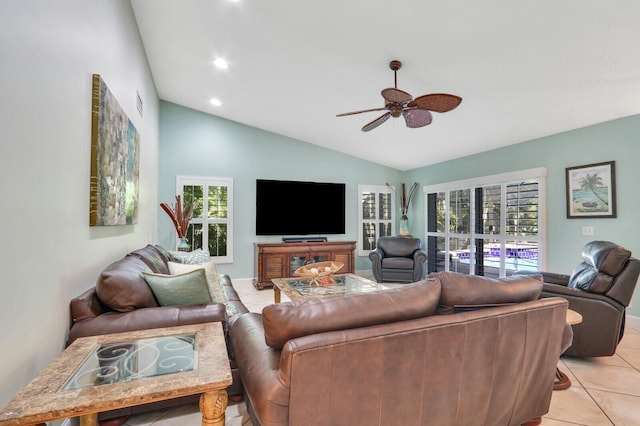 living area with a ceiling fan, lofted ceiling, recessed lighting, and light tile patterned floors