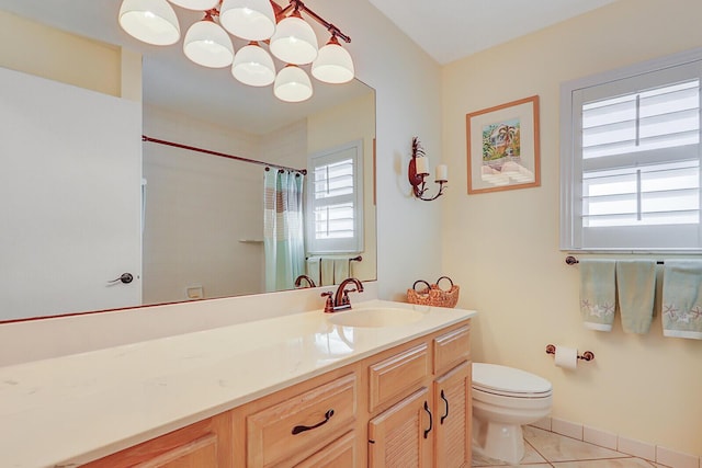 full bathroom with curtained shower, toilet, vanity, tile patterned flooring, and baseboards