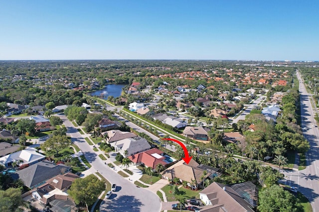 bird's eye view with a water view and a residential view