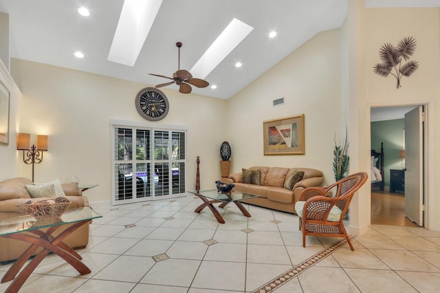 living area featuring high vaulted ceiling, light tile patterned flooring, recessed lighting, a skylight, and visible vents