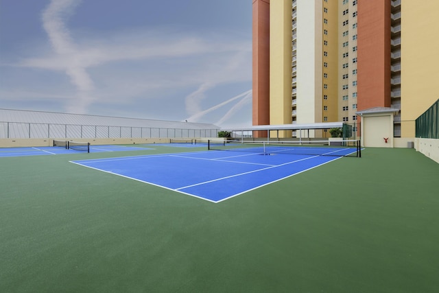 view of sport court featuring community basketball court and fence