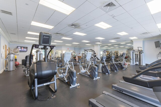 exercise room featuring a paneled ceiling and visible vents