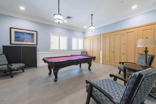 game room with light wood-type flooring, pool table, visible vents, and crown molding