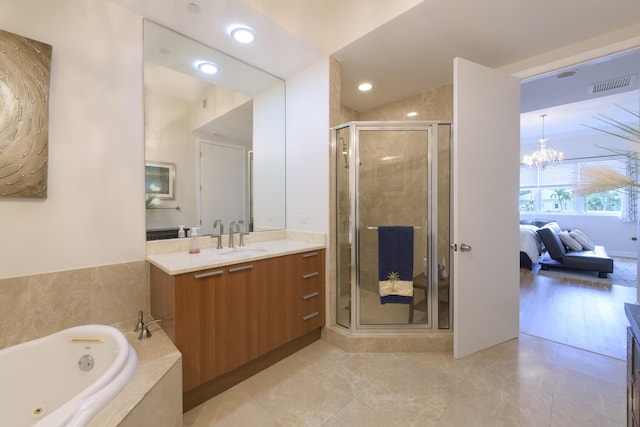 ensuite bathroom featuring visible vents, ensuite bathroom, vanity, a shower stall, and a tub with jets