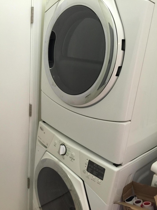 laundry area featuring laundry area and stacked washer / dryer