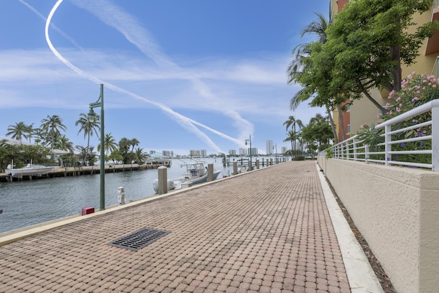 view of home's community featuring a water view and a boat dock