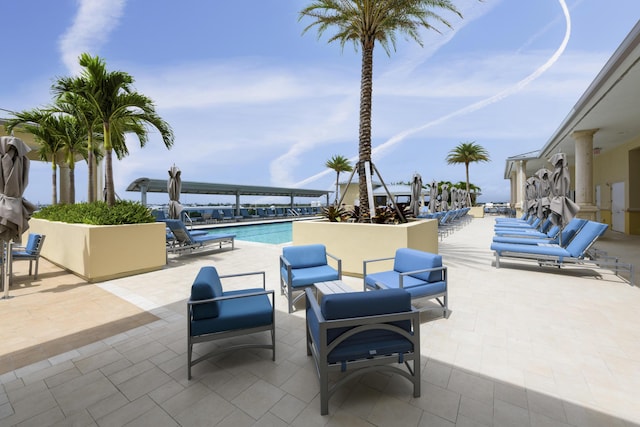 view of patio / terrace featuring a community pool