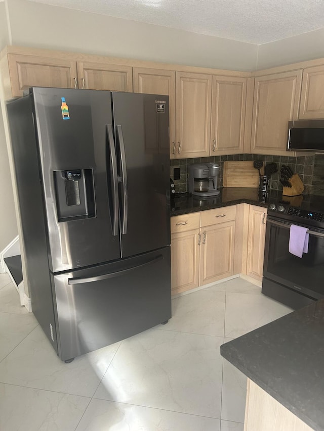 kitchen featuring marble finish floor, stainless steel appliances, light brown cabinetry, and tasteful backsplash