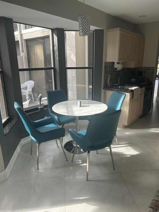 dining room with baseboards