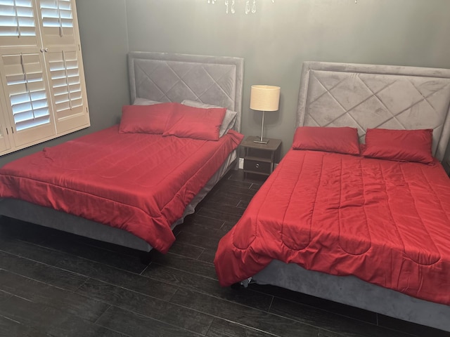 bedroom featuring wood finished floors