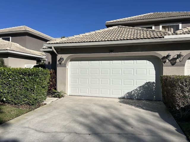 garage with concrete driveway