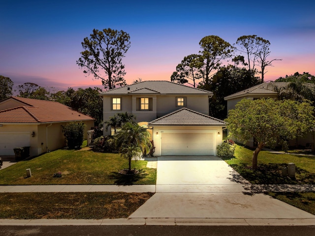 6721 Stonecreek St, Greenacres, FL 33413 - mediterranean / spanish-style house with a tiled roof, stucco siding, a yard, concrete driveway, and an attached garage