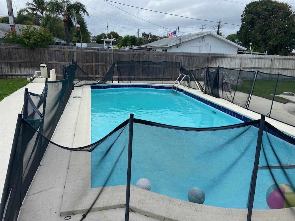 view of pool with a fenced in pool and a fenced backyard