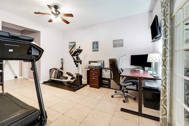 office area with a ceiling fan and light tile patterned flooring