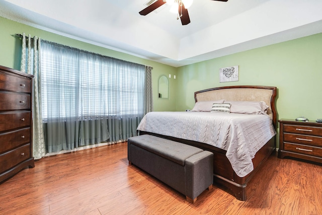 bedroom featuring a ceiling fan and wood finished floors