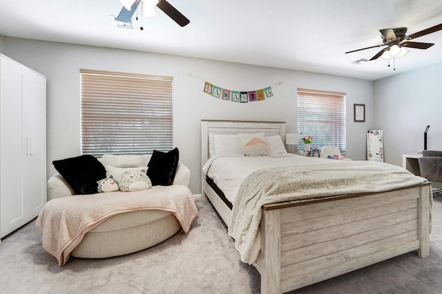 carpeted bedroom with ceiling fan