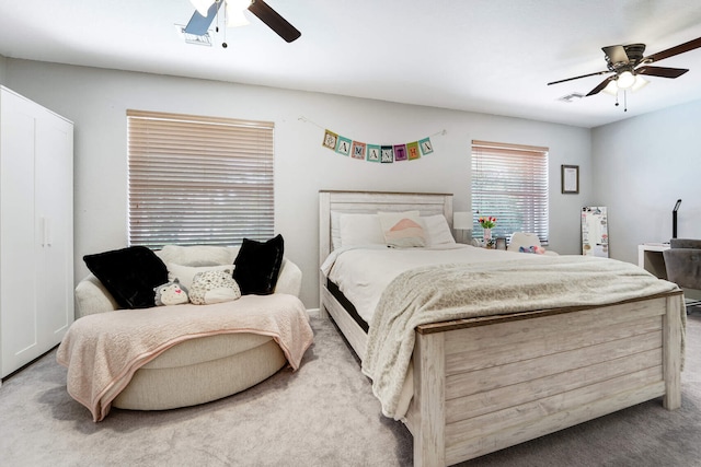 carpeted bedroom featuring a ceiling fan