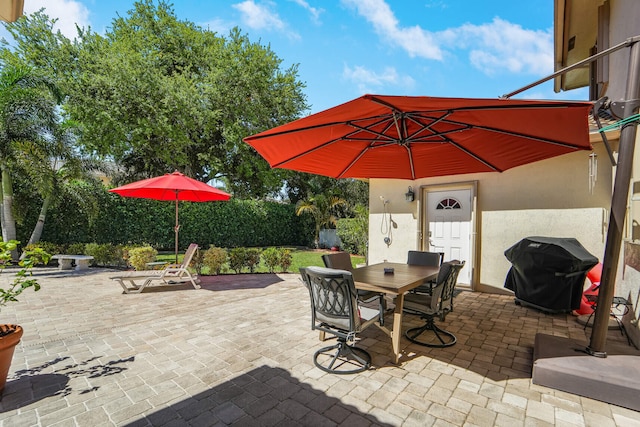 view of patio / terrace with a grill and outdoor dining space