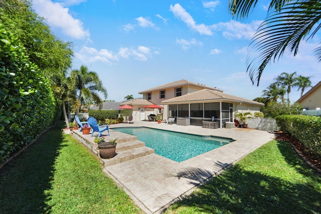 view of swimming pool with a fenced backyard, a yard, a sunroom, a fenced in pool, and a patio area