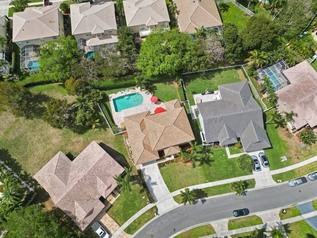 birds eye view of property with a residential view