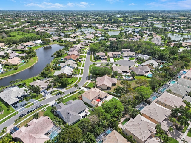 bird's eye view featuring a residential view and a water view