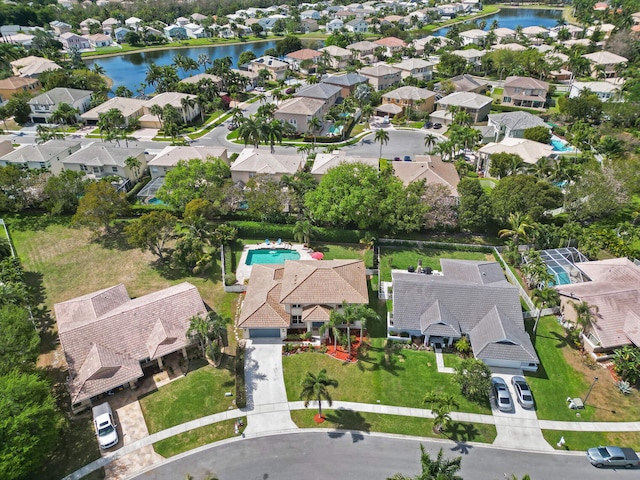 birds eye view of property featuring a residential view and a water view