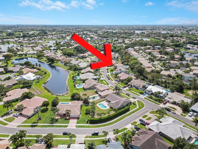 aerial view featuring a water view and a residential view
