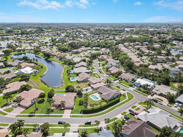 bird's eye view featuring a residential view and a water view