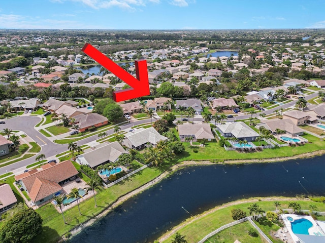 bird's eye view with a water view and a residential view