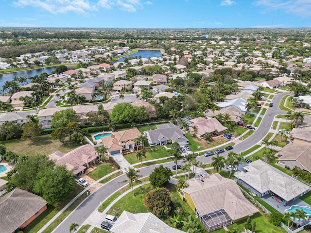 bird's eye view featuring a residential view and a water view